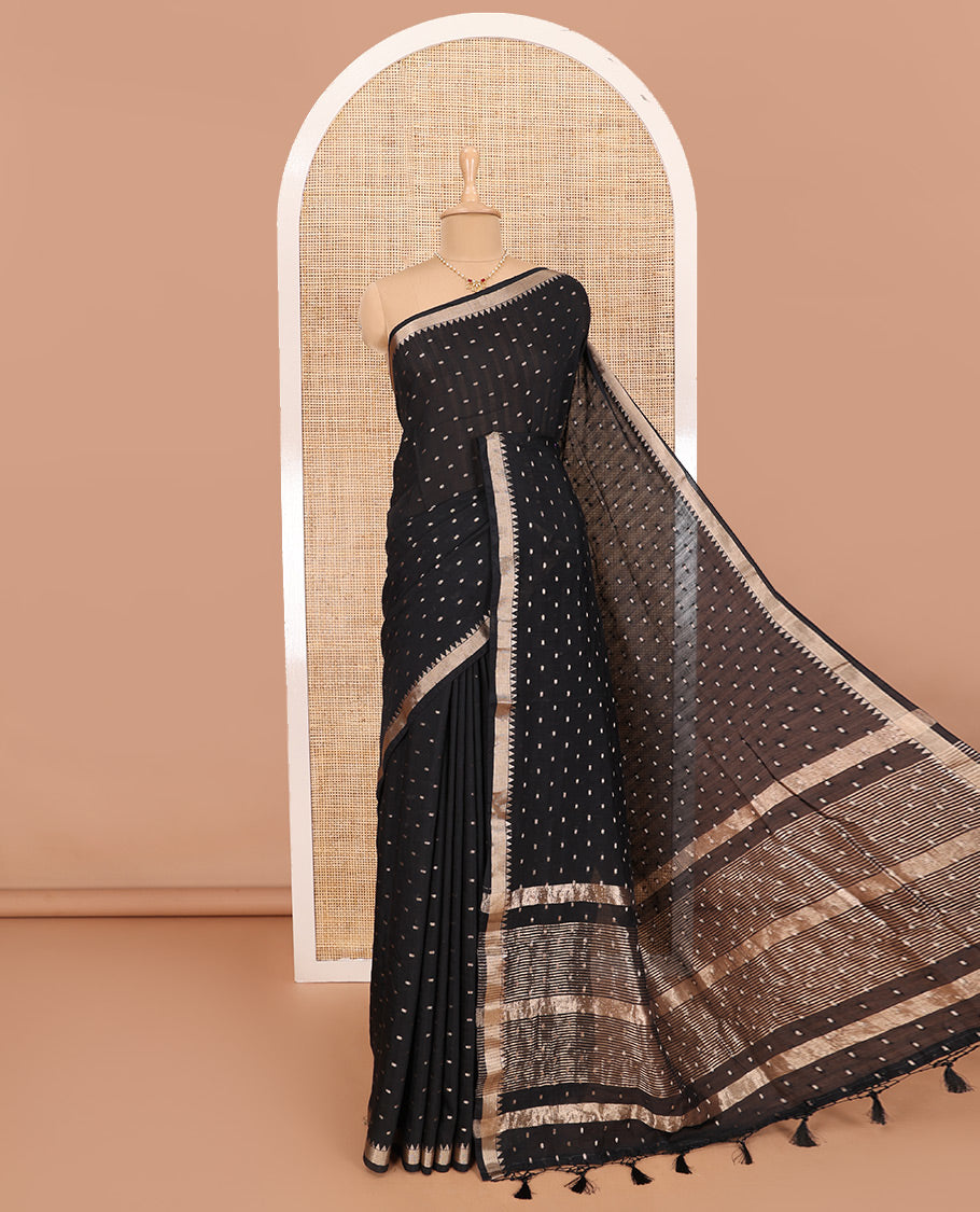 Black Assam Silk Saree Features Bright Zari Buttas All Over Its Body, a Subtle Temple Zari Border, a Pallu Highlighted with Zari Stripes, and Comes with a Matching Blouse