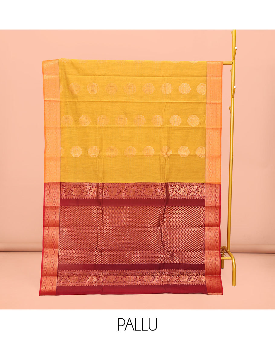 Yellow Semi-Silk Cotton Saree, Subtly Enriched with Zari Buttas All Over Its Body, Highlighted by a Zari Traditional Design Border, Complemented by a Contrast Pallu of Jaal Design, and Paired with a Contrast Blouse