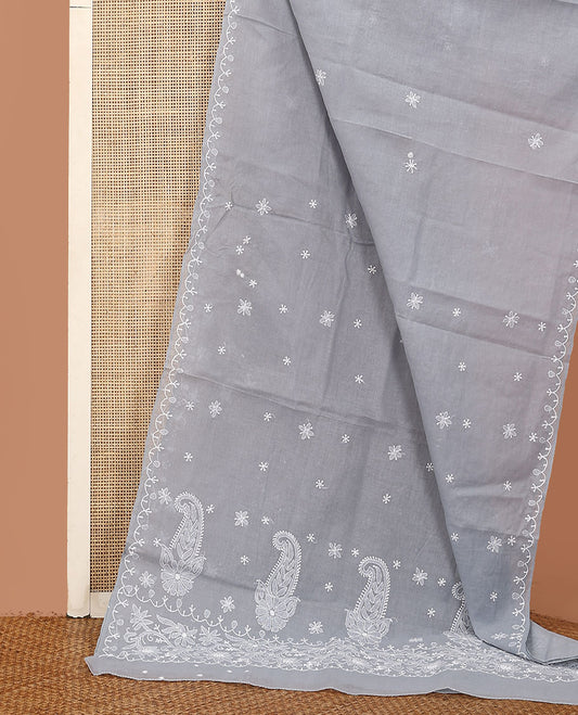 Grey embroidered buttas Lucknowi chikankari saree, thread embroidered border, and floral-paisley motifs embroidered pallu