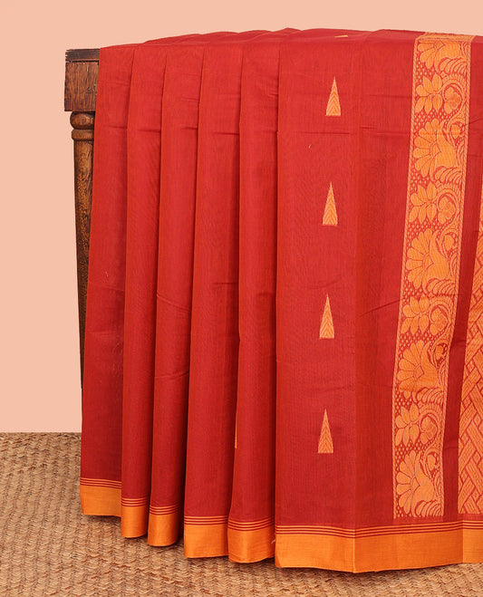Red Kanchi Cotton Saree, Highlighted by Temple Buttas All Over Its Body, Complemented by a Contrast Border, Pallu Depicts Intricate Designs, and Paired with a Matching Blouse