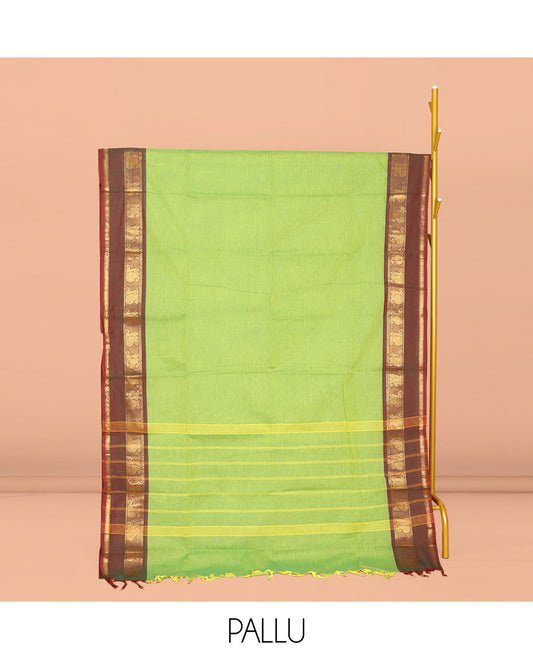 Parrot Green Plain Chettinad Cotton Saree, Complemented by Contrast Traditional Zari Design Rettai Pettu Border of Paisleys, Striped Pallu, and Paired with Matching Blouse