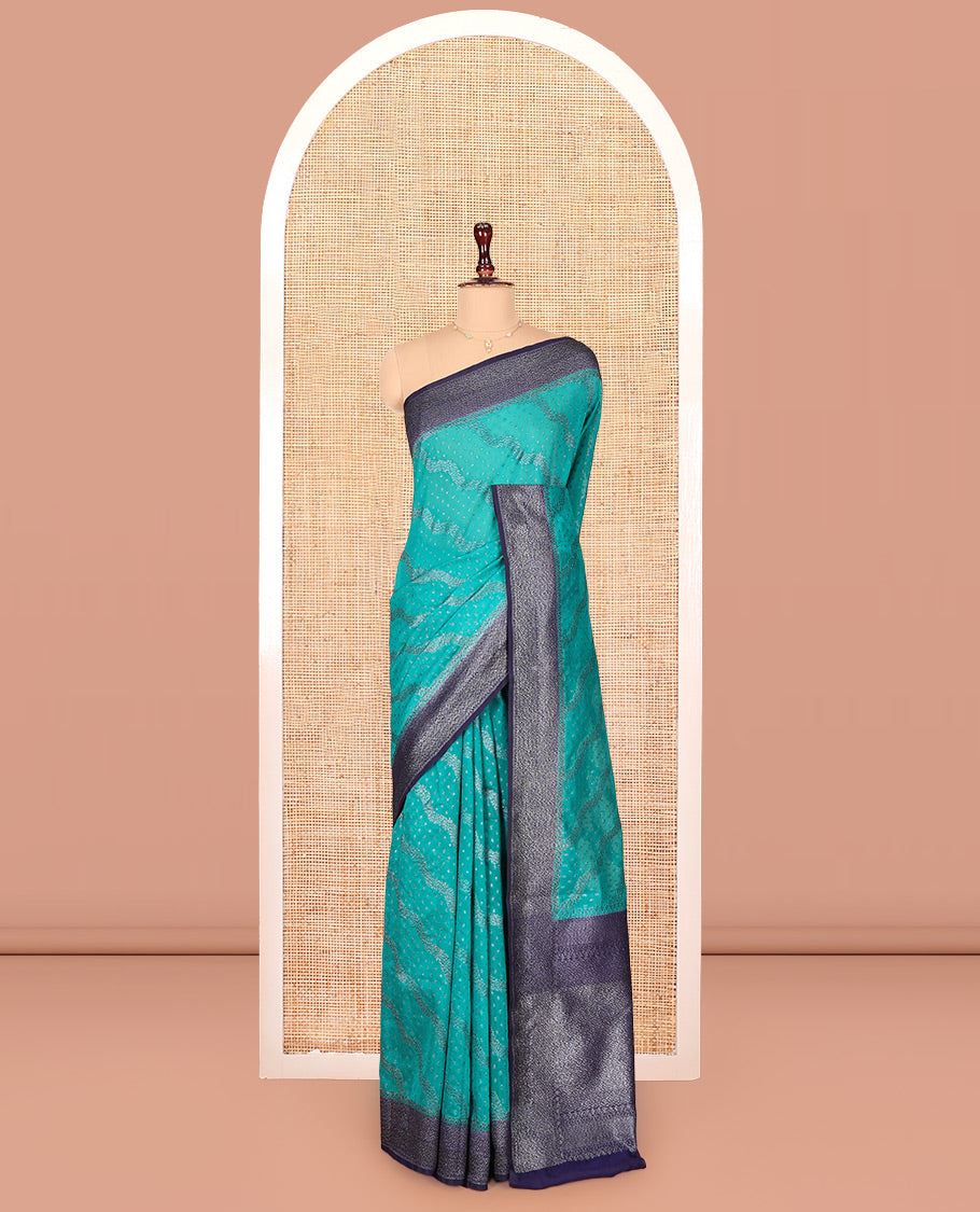 Blue Dola Silk Saree, Woven with Zari Buttas and Chevron on Its Body, Complemented by Contrast Zari Border, Gleaming Zari Pallu, and Paired with a Contrast Blouse