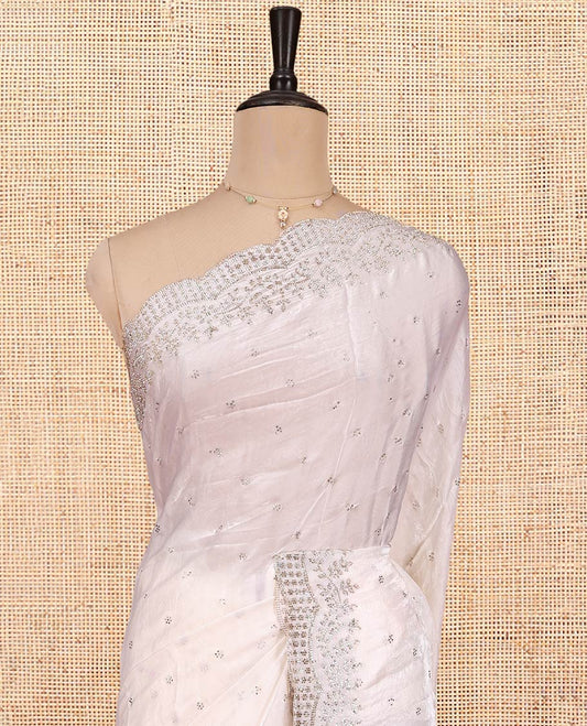 White Designer Saree, Enthralled with Stone Work All Over Its Body, a Scallop Stone Embroidered Border, and Matching Blouse