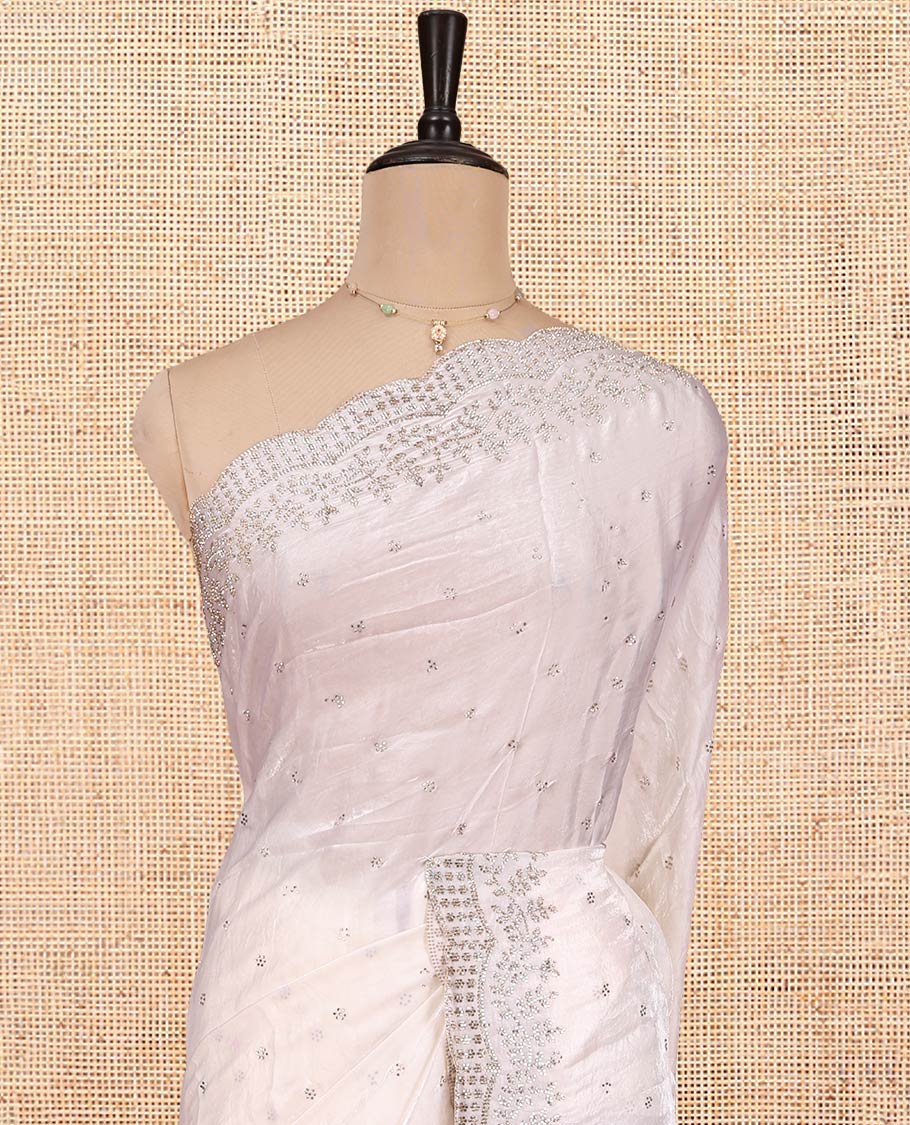 White Designer Saree, Enthralled with Stone Work All Over Its Body, a Scallop Stone Embroidered Border, and Matching Blouse