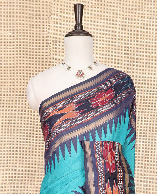 Light Blue Plain Dupion Silk Saree, Bedecked with a Contrast Temple Border of Geometric Patterns and Ikkat Weave, Pallu Depicting Floral Ikkat Designs, and Paired with a Contrast Blouse