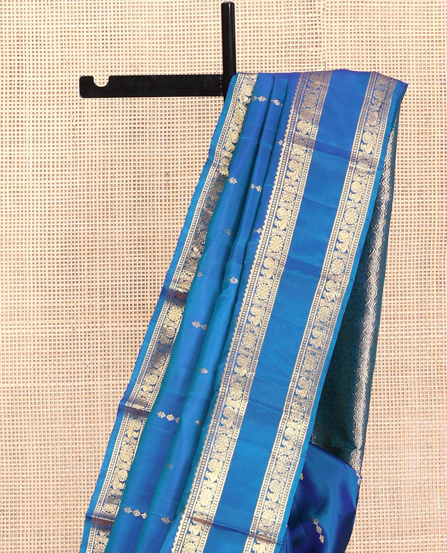 Blue Kanchipuram Silk Saree, Majestically Detailed with Zari Buttas, Highlighted by Zari Traditional Rettai Pettu Border, Grand Pallu, and Matching Blouse