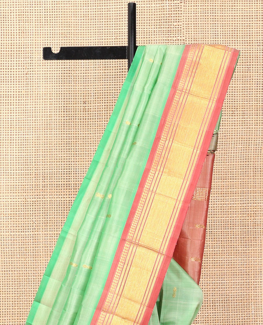 Green Kanchipuram Silk Saree, Showcasing Zari Buttas, a Contrast One-Sided Border of Panner Sombu, Banaras, and Vanki  Designs, a Zari Design Pallu, and No Blouse