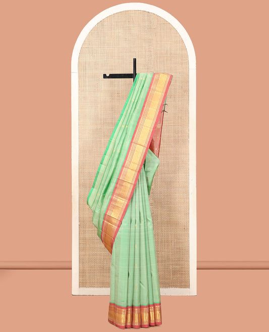 Green Kanchipuram Silk Saree, Showcasing Zari Buttas, a Contrast One-Sided Border of Panner Sombu, Banaras, and Vanki  Designs, a Zari Design Pallu, and No Blouse