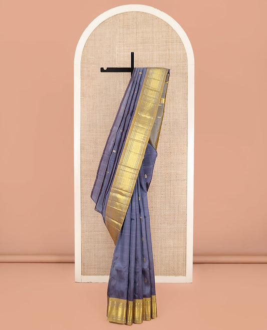 Grey Kanchipuram Silk Saree, Graced with Zari Buttas on Its Body, Complemented by a Contrast One-Sided Border of Panner Sombu, Banaras, Muthu, and Jaal Designs, Pallu of Zari Designs, and Comes Without a Blouse