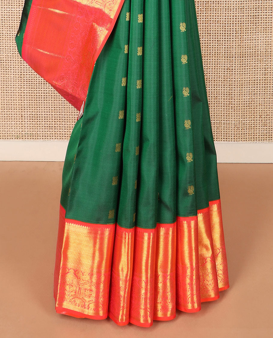 Green zari buttas Kanchipuram silk saree, contrast border of thilakam mokku, banaras, muthu, and mayil designs, and pallu of neli designs