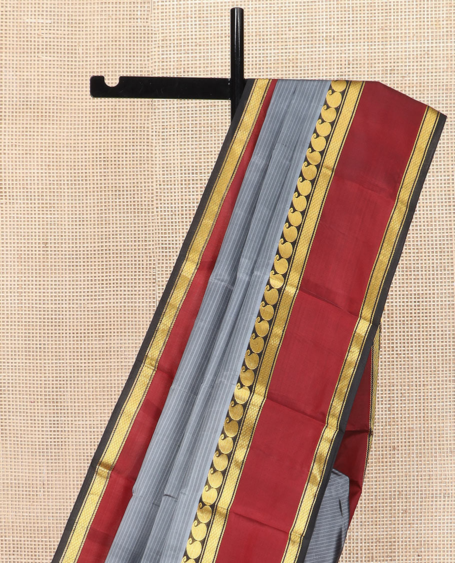 Grey Striped Kanchipuram Silk Saree Adorned with a Contrast Rettai Pettu Border Featuring Manga, Banaras, and Mayil Kann Designs, a Subtle Striped Pallu, and a Contrast Blouse