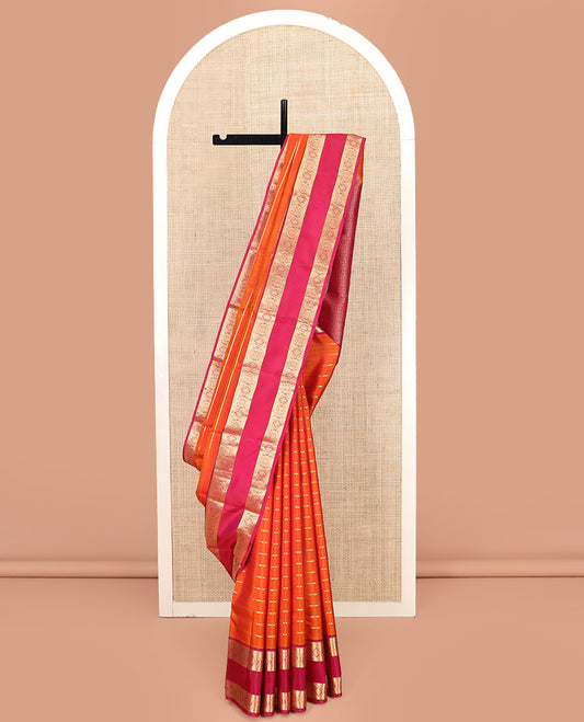 Orange Kanchipuram Silk Saree, Mesmerized with Zari Stripes on Its Body, Complemented by a Contrast Rettai Pettu Border of Manga, Muthu, Banaras, and Chakram Designs, Pallu of Intricate Design Weave, and Paired with a Contrast Blouse