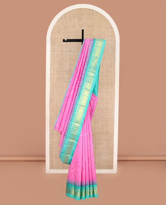 Pink Kanchipuram Silk Saree, Beautifully Bedecked with Zari Buttas on Its Body, Complemented by Contrast One-Sided Temple Border of Thilakam Mokku, Banaras, Muthu, and Chakram Designs, Pallu of Zari Designs, and Comes Without a Blouse
