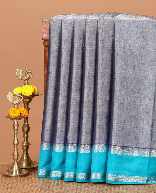 Neavy Blue plain design Tissue silk saree, contrast traditional zari border of bentex design & lined pallu with tassels