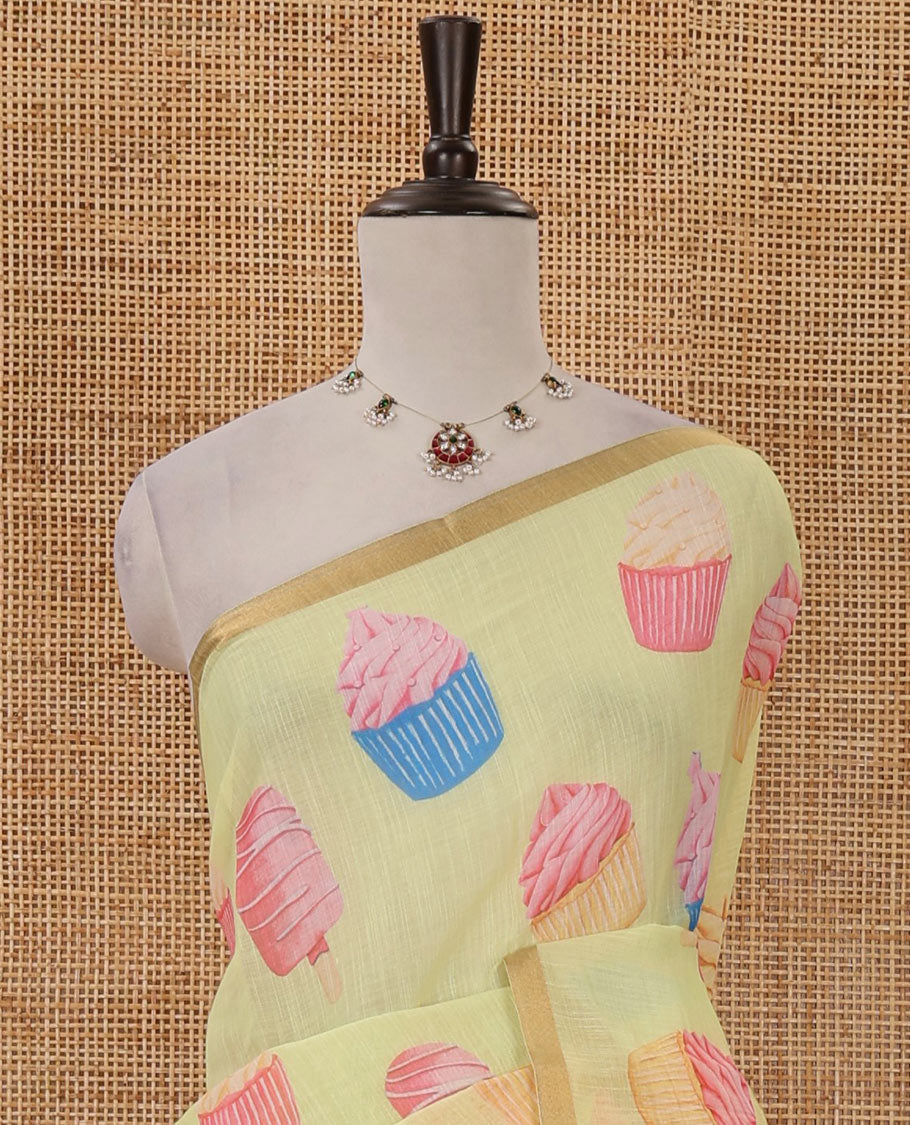 Pastel yellow cupcake & Ice Cream motifs printed Linen saree, piping border, contrast Cone Ice Cream motif printed pallu & pink printed blouse