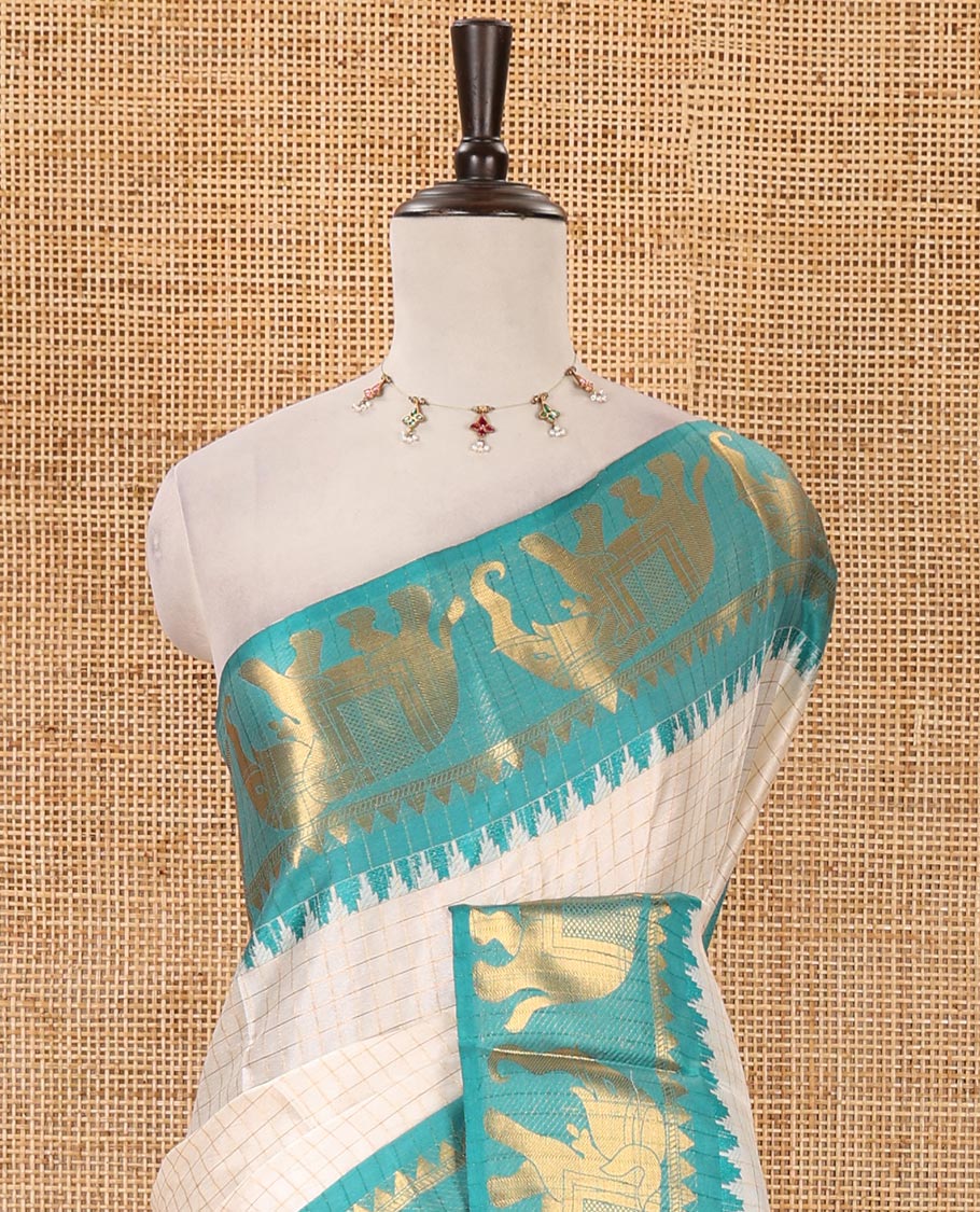 White checked semi-tafeta saree, contrast temple zari elephant motifs blue color border, zari-rich pallu & contrast checked zari border blouse