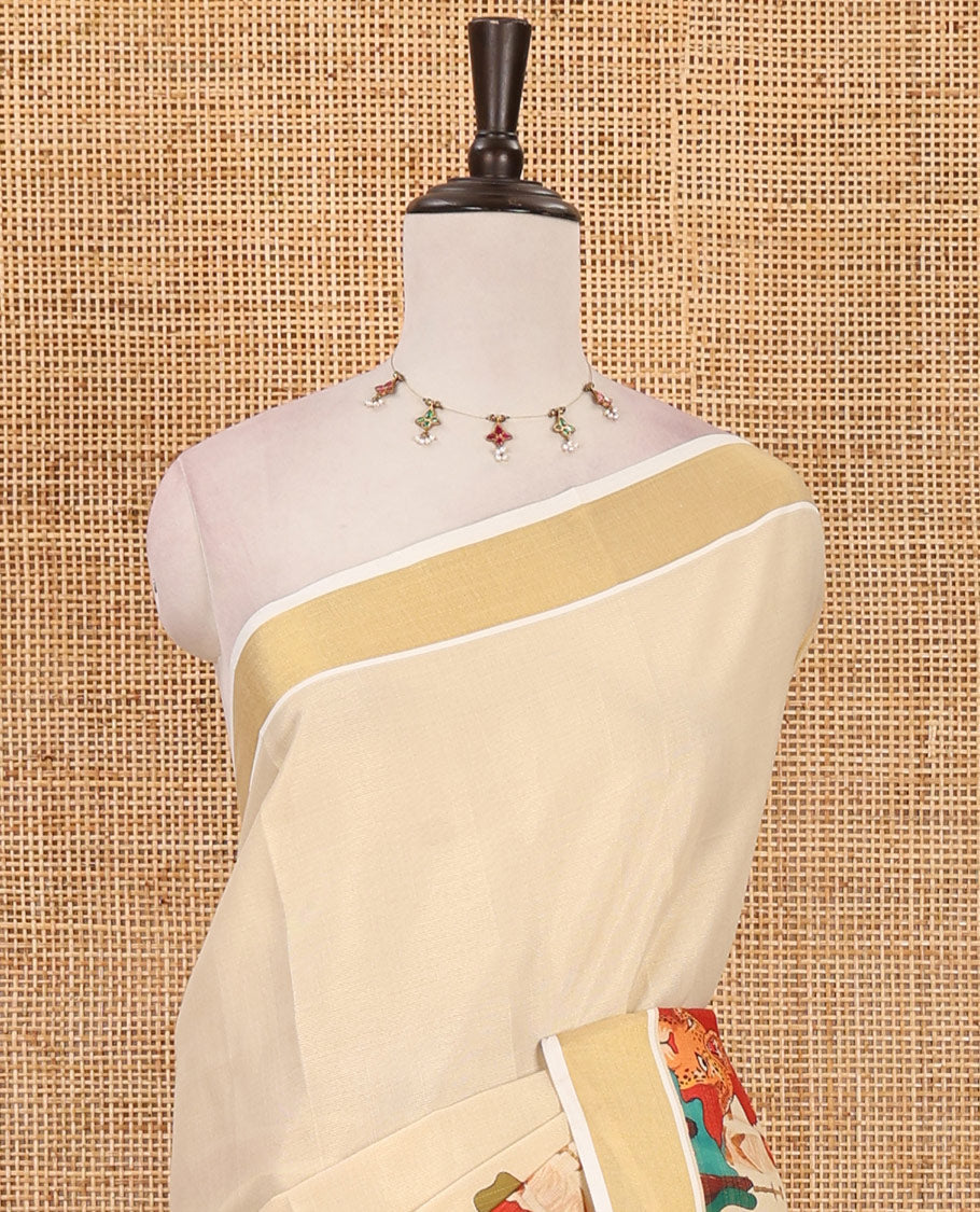 Cream kathakali motifs printed kerala saree, gold zari bavanji border, big kathakali motifs printed pallu & contrast Ajrakh printed blouse