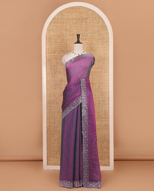 Purple Swarovski crystal stone embedded fendy chiffon saree, scallop border accentuated with floral and scallop design in Swarovski stones