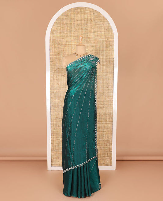 Rama green micro-stone work fendy chiffon saree with paisley stone work on its shoulder, a scallop stone work border, a butterfly style pallu, and a matching stone work blouse