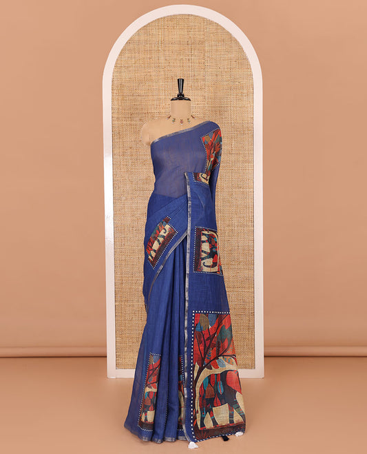 Indigo blue plain linen cotton saree, mordern art style elephant motifs printed border, elephant printed pallu, and a contrast floral vine printed blouse