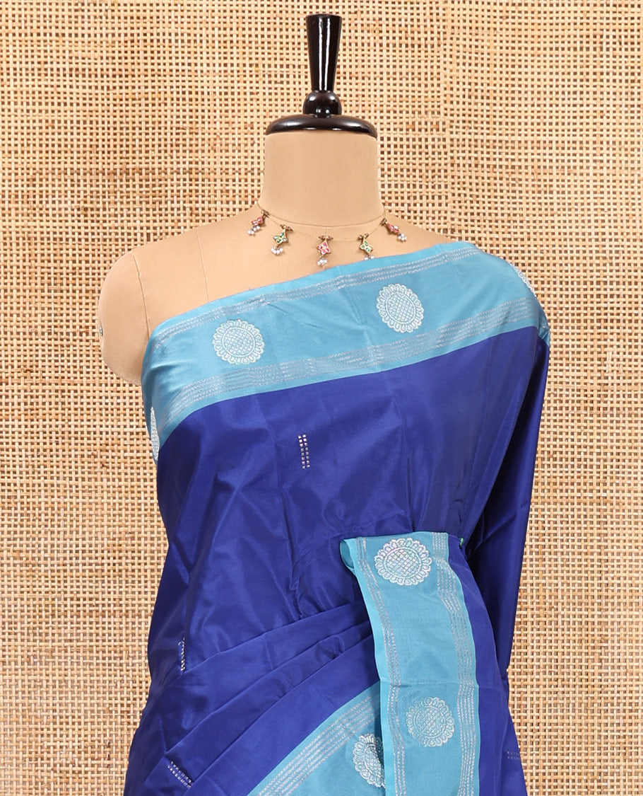 Royal blue zari buttas semi-soft silk saree, contrast thazampoo rekku zari buttas and striped border, striped pallu, and a plain blouse