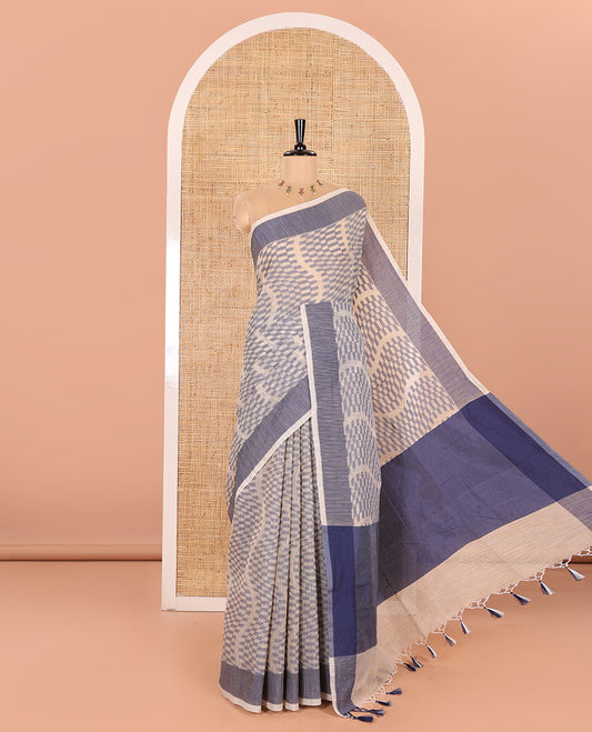 Chikku and Blue Kota Cotton Saree Subtly Woven with Zig-Zag Checks in Thread, Subtly Sparkled Contrast Bavanji Border, Plain Pallu, and Paired with a Matching Blouse