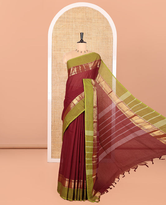 Maroon Plain Chettinad Cotton Saree, Complemented by Contrast Traditional Zari Temple Border, Subtly Striped Pallu, and Paired with a Matching Blouse