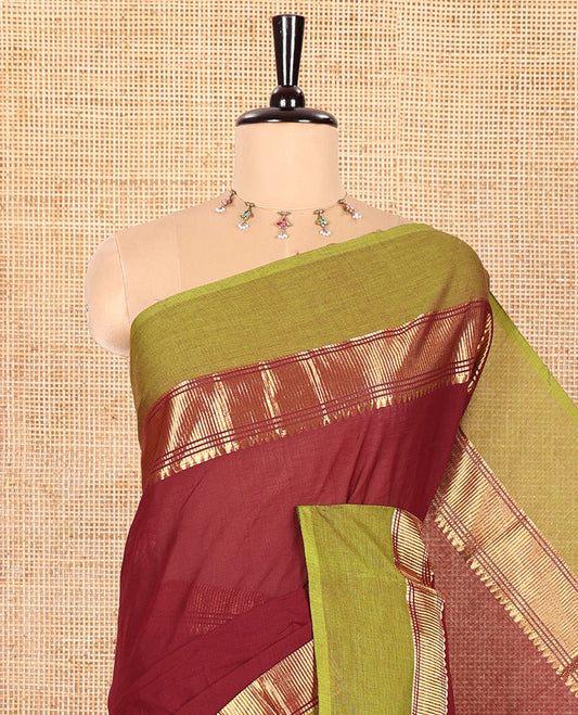 Maroon Plain Chettinad Cotton Saree, Complemented by Contrast Traditional Zari Temple Border, Subtly Striped Pallu, and Paired with a Matching Blouse