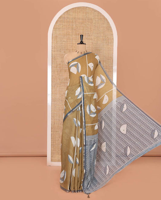 Green Linen Saree, Subtly Sparkled with Geometric Print and Mirror Work on Its Body, Subtle Piping Border, Pallu Steeped with Geometric Patterns, and Paired with Unique Motifs Printed Contrast Blouse