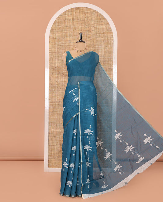 Blue Linen Cotton Saree, Adorned with Pichwai Lotus Motifs Print, Subtle Piping Border, Pallu Mirrors the Same Pichwai Lotus Print, and Paired with a Contrast Pichwai Lotus Printed Blouse