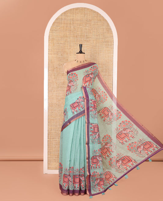 Green Plain Linen Cotton Saree, Artfully Detailed with Elephant Motifs on Piping Border, Pallu of Elephant Motifs Print, and Paired with a Contrast Blouse