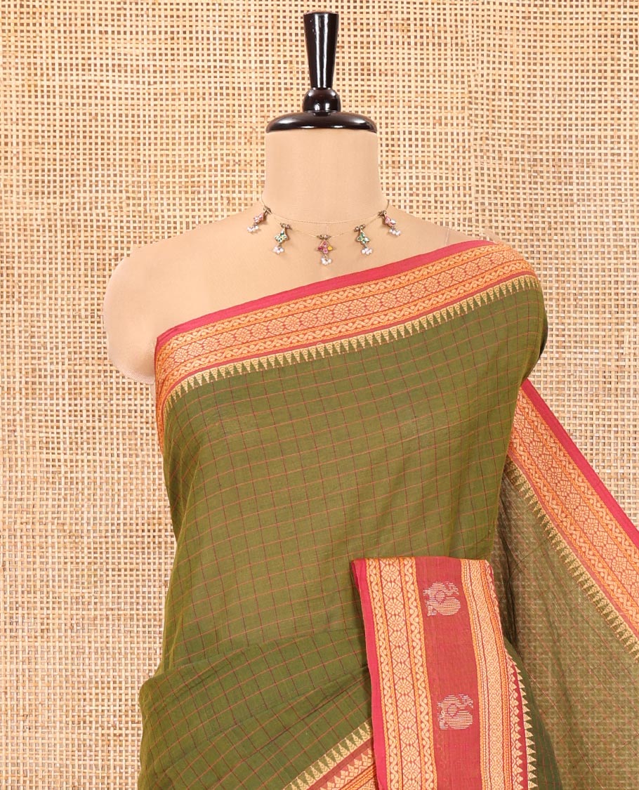 Green Chettinad Cotton Saree, Subtly Sparkled with Checks on Its Body, Complemented by a Contrast Traditional Border of Peacock Designs, Subtly Striped Pallu, and Paired with a Matching Blouse
