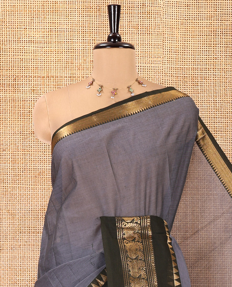 Grey Plain Chettinad Cotton Saree, Complemented by Contrast Rettai Pettu Traditional Zari Border of Temple and Peacock Designs, Striped Pallu, and Paired with a Matching Blouse