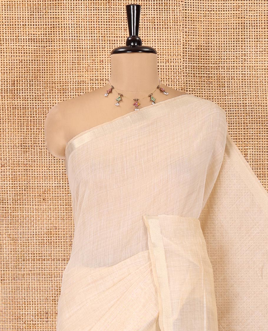 Cream Plain Jamdani Cotton Saree, Highlighted by a Golden Zari Border, Pallu of Kashmiri-Style Weaving, and Paired with a Contrast Striped Blouse