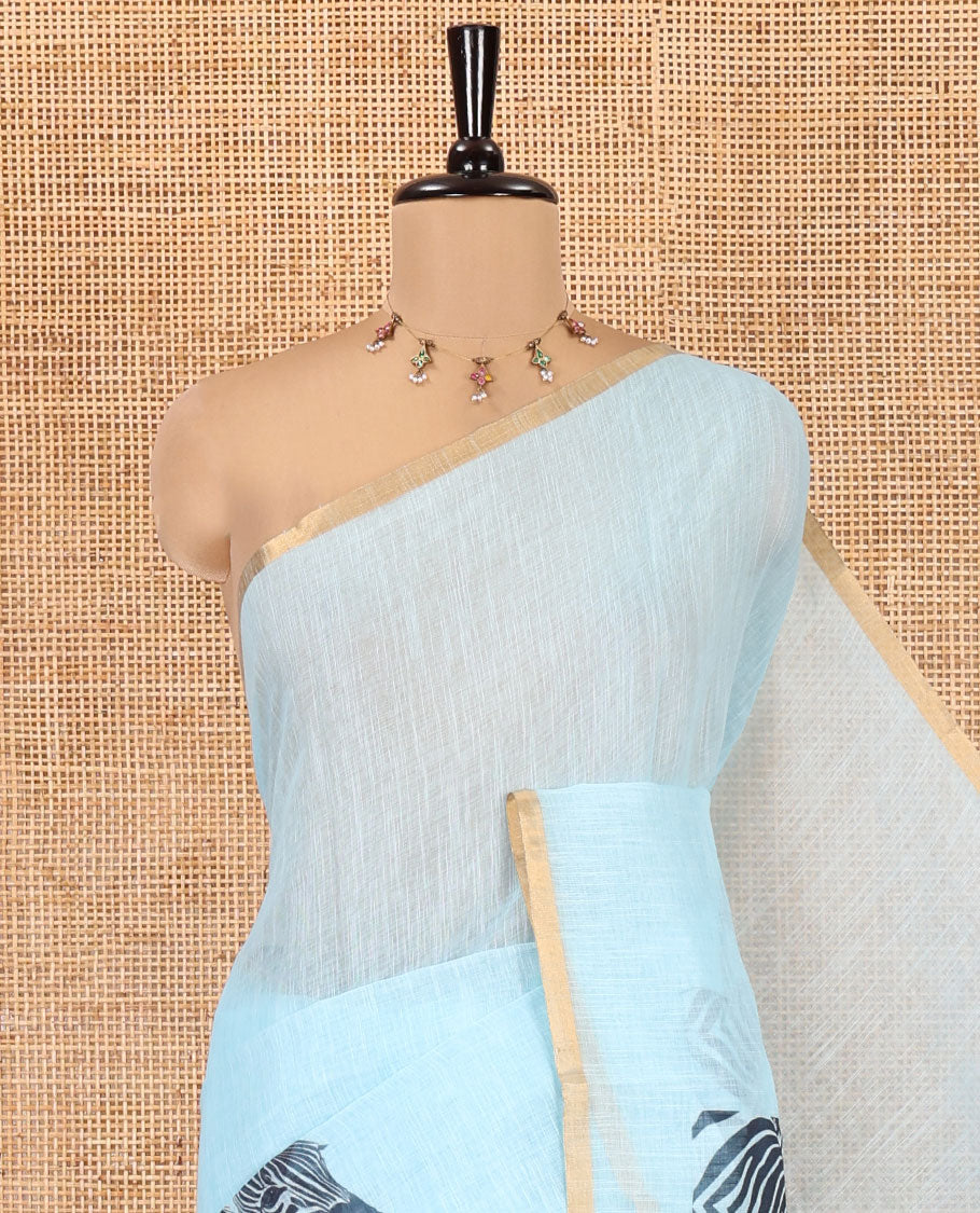 Sky Blue Linen Cotton Saree, Accentuated with Zebra Motifs Print, A Subtle Piping Border, Zebra Printed Pallu, and Comes with a Contrast Blouse