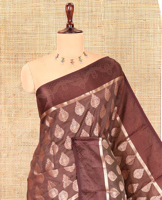 Brown Semi-Tussar Saree, Delicately Woven with Zari Buttas, a Satin Embossed Border, Gleaming Pallu, and a Matching Blouse