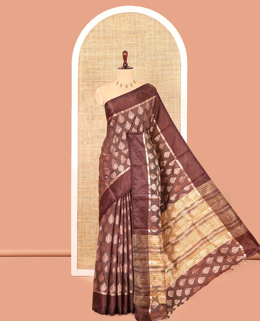 Brown Semi-Tussar Saree, Delicately Woven with Zari Buttas, a Satin Embossed Border, Gleaming Pallu, and a Matching Blouse