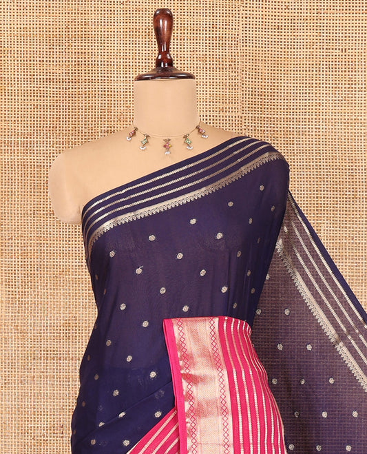 Navy Blue Art Crepe Saree Features Zari Buttas, Complemented by Contrast Traditional Zari Border, Zari Striped Pallu, and a Contrast Blouse