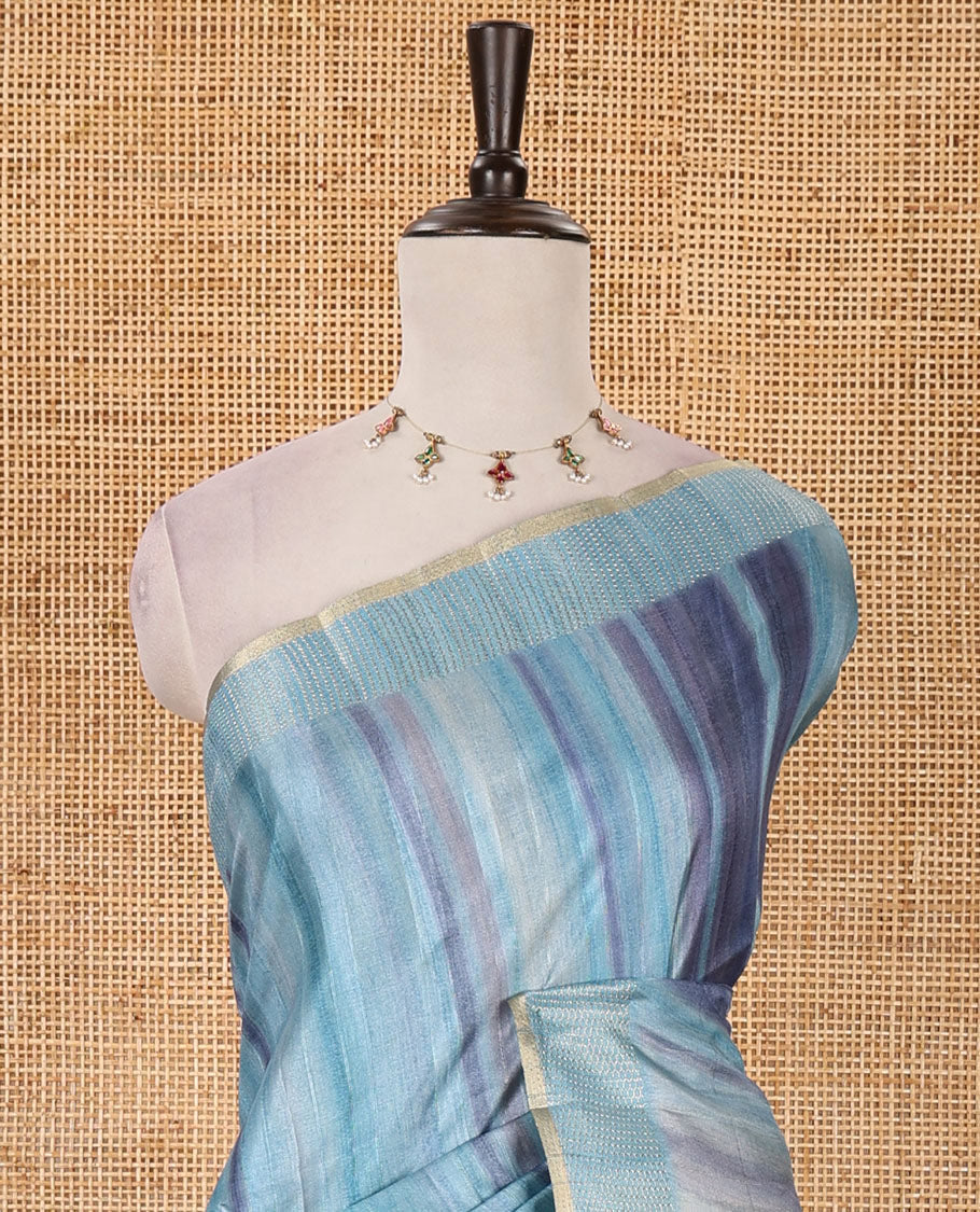 Sky blue hand brushing-style multi-colored stripes printed fancy tussar silk saree, zari border, self-pallu & blouse of zari work & stripes print