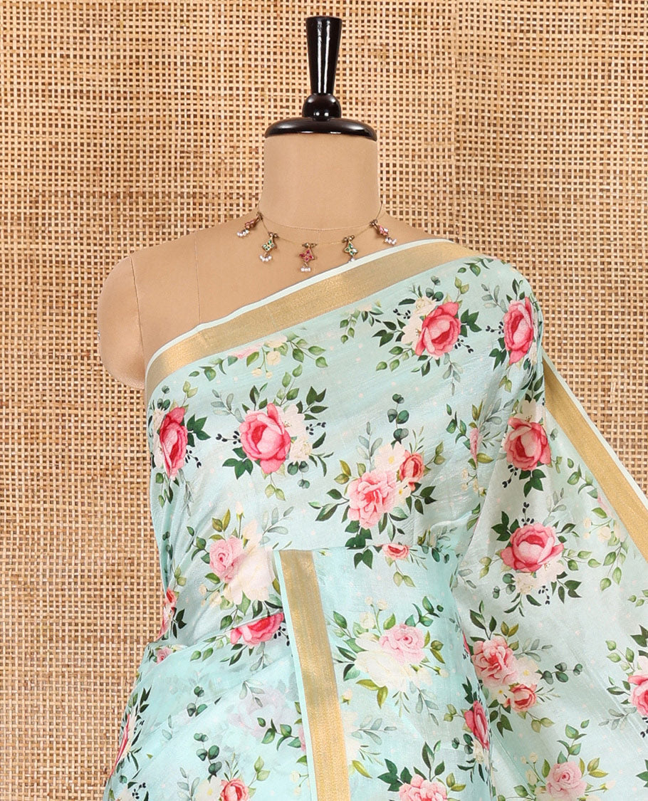 Mint green colorful rose floral motifs digital printed banana pith saree, piping border, striped pallu, and floral printed blouse