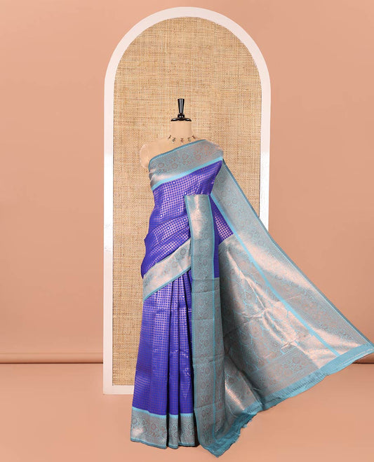 Blue Litchi Saree, Elegantly Framed with Polka Dot Buttas Enclosed Checks on Its Body, Complemented by a Contrast Traditional Zari Border of Floral Creeper Designs, Majestically Zari Detailed Pallu, and Paired with a Contrast Blouse