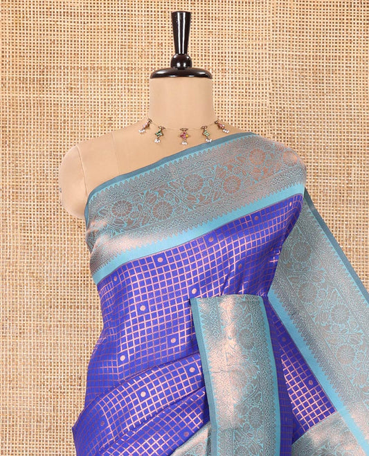 Blue Litchi Saree, Elegantly Framed with Polka Dot Buttas Enclosed Checks on Its Body, Complemented by a Contrast Traditional Zari Border of Floral Creeper Designs, Majestically Zari Detailed Pallu, and Paired with a Contrast Blouse