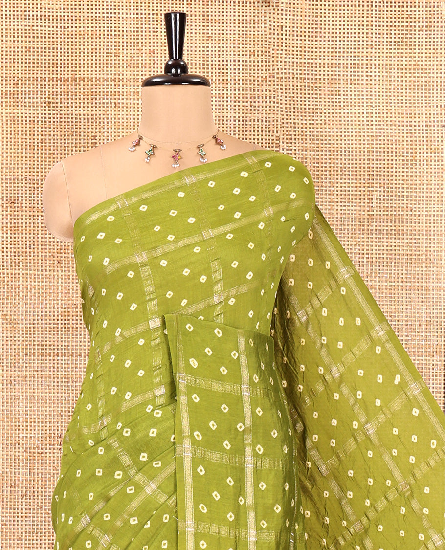 Borderless Green Assam Silk Saree, Richly Detailed with Bandhani-Dotted Ghar Chola Design on Its Body, Gleaming Zari Pallu, and Paired with a Matching Blouse