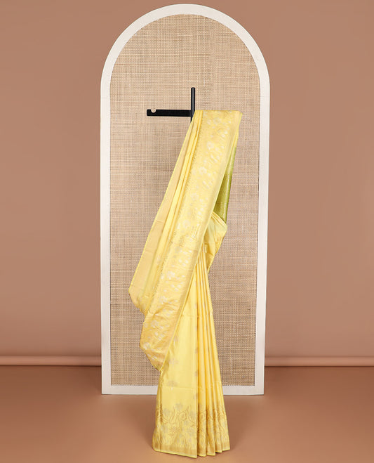 Light yellow tree buttas soft silk saree with self floral design & intricate zari design pallu