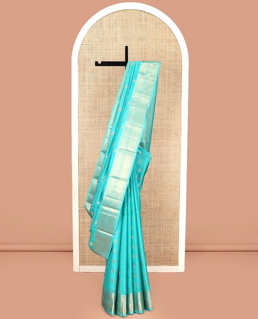 Blue Vasundhara Lite Silk Mix Saree, Sparsely Woven with Zari Buttas, Highlighted by a Zari Border of Rekku, Kamalam, and Mayil Kann Designs, Pallu of Jaal Designs, and Paired with a Matching Blouse