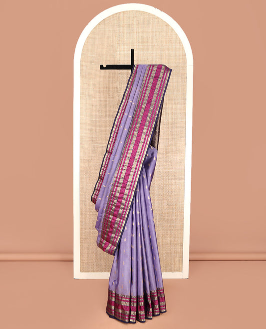 Lavender Vasundhara Lite Silk Mix Saree, Embellished with Zari Buttas on Its Body, Complemented by a Contrast Border of Rekku, Muthu, and Kodi Visiry Designs, Pallu Steeped with Chakram Designs, and Paired with a Contrast Blouse