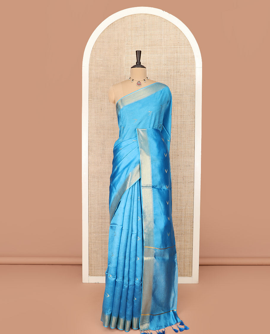 Blue Banana Pith Saree Decorated with Zari Temple Buttas, Delicately Woven Temple Zari Border, Gleaming Zari Pallu of Horizontal Stripes in Zari, and Paired with a Matching Plain Blouse