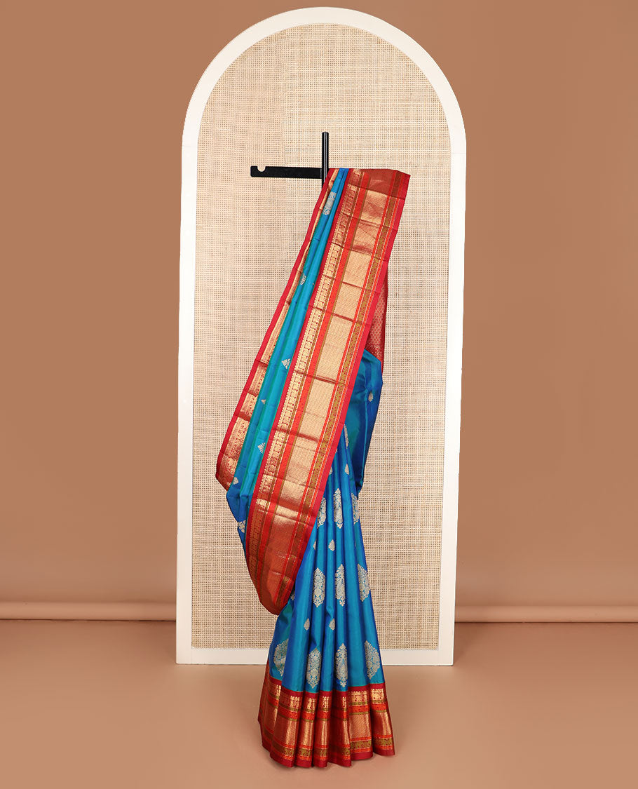 Blue zari buttas silk saree, contrast border of rekku,muthu,mayil,yaanai,rudraksham & ara maadam & circular motifs woven pallu