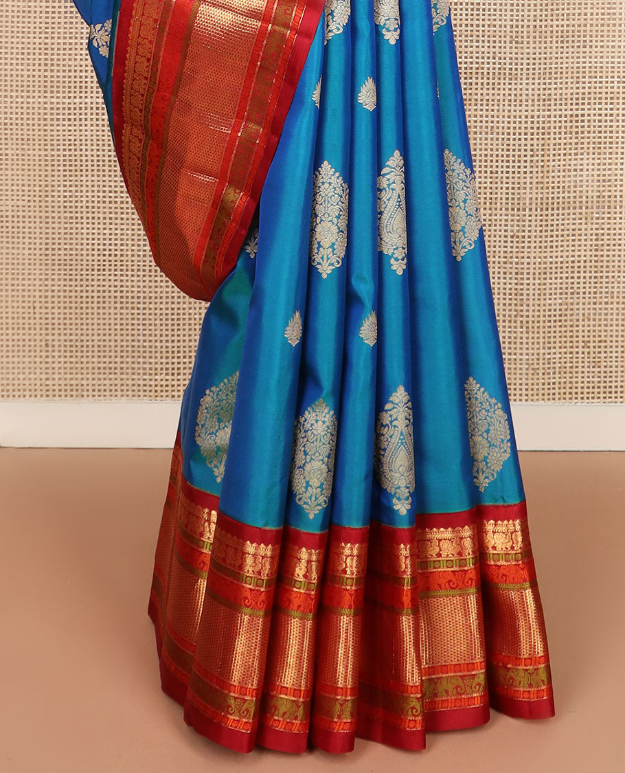 Blue zari buttas silk saree, contrast border of rekku,muthu,mayil,yaanai,rudraksham & ara maadam & circular motifs woven pallu