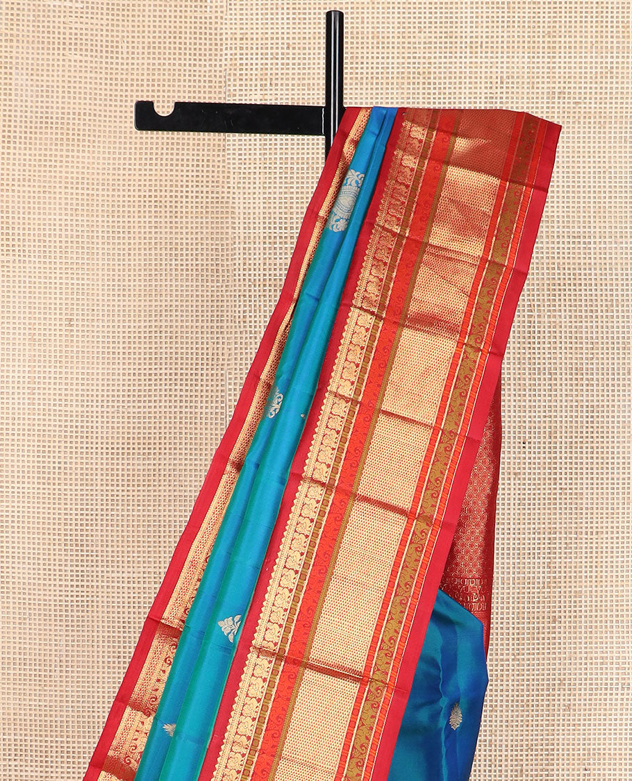 Blue zari buttas silk saree, contrast border of rekku,muthu,mayil,yaanai,rudraksham & ara maadam & circular motifs woven pallu